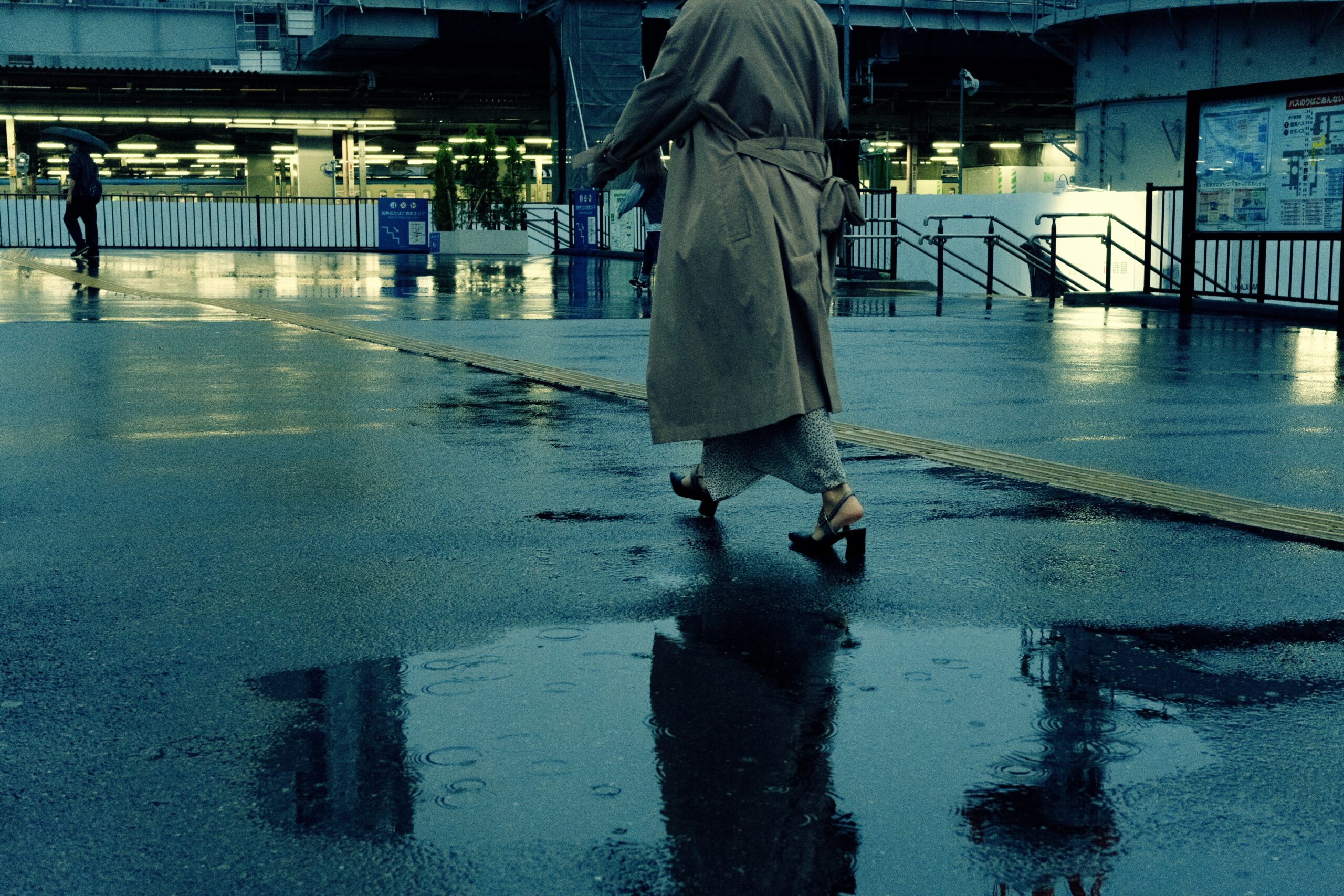 Image showing a traveler stranded at an airport due to a storm