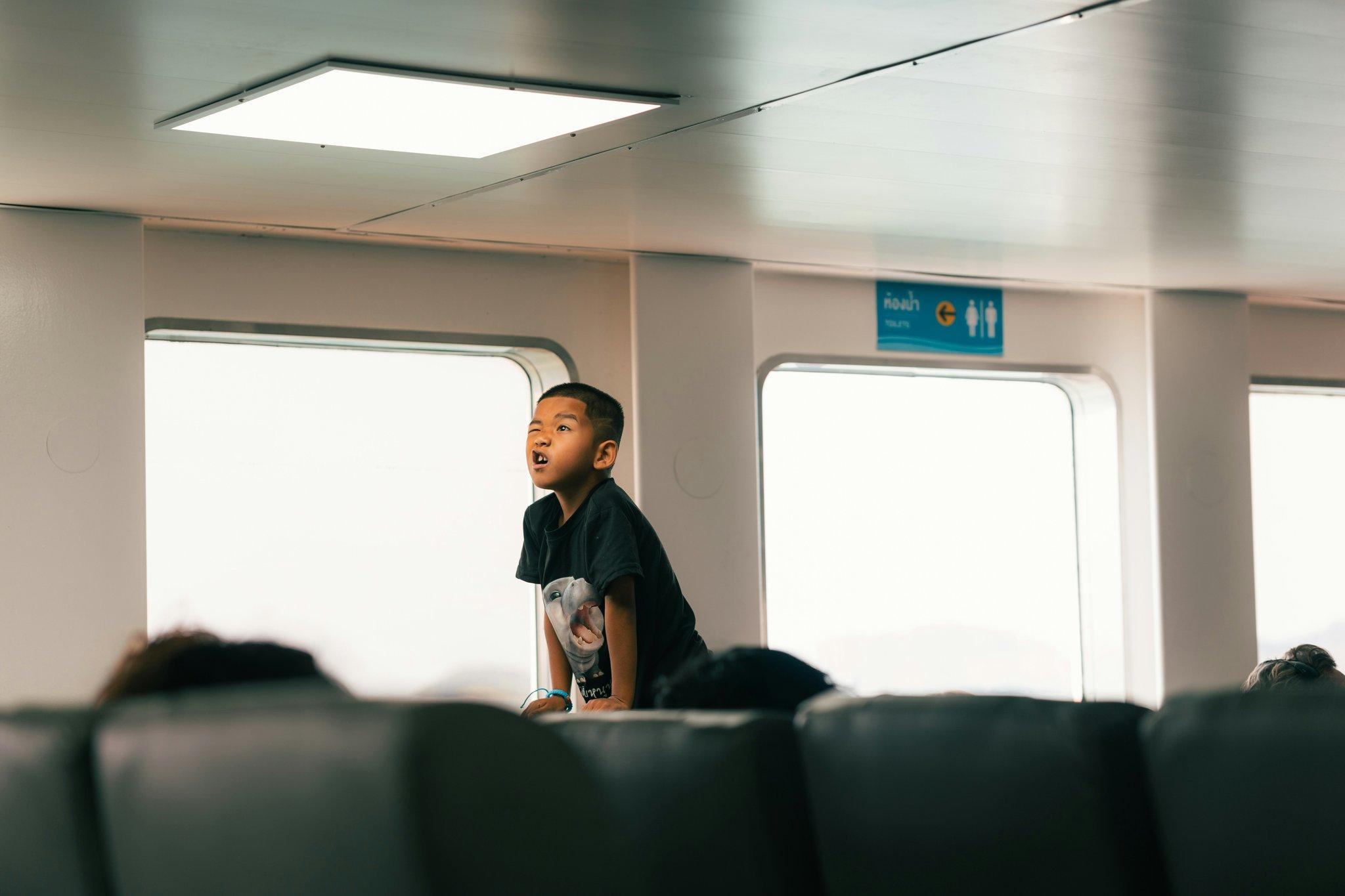 A frustrated traveler sitting at an airport waiting area