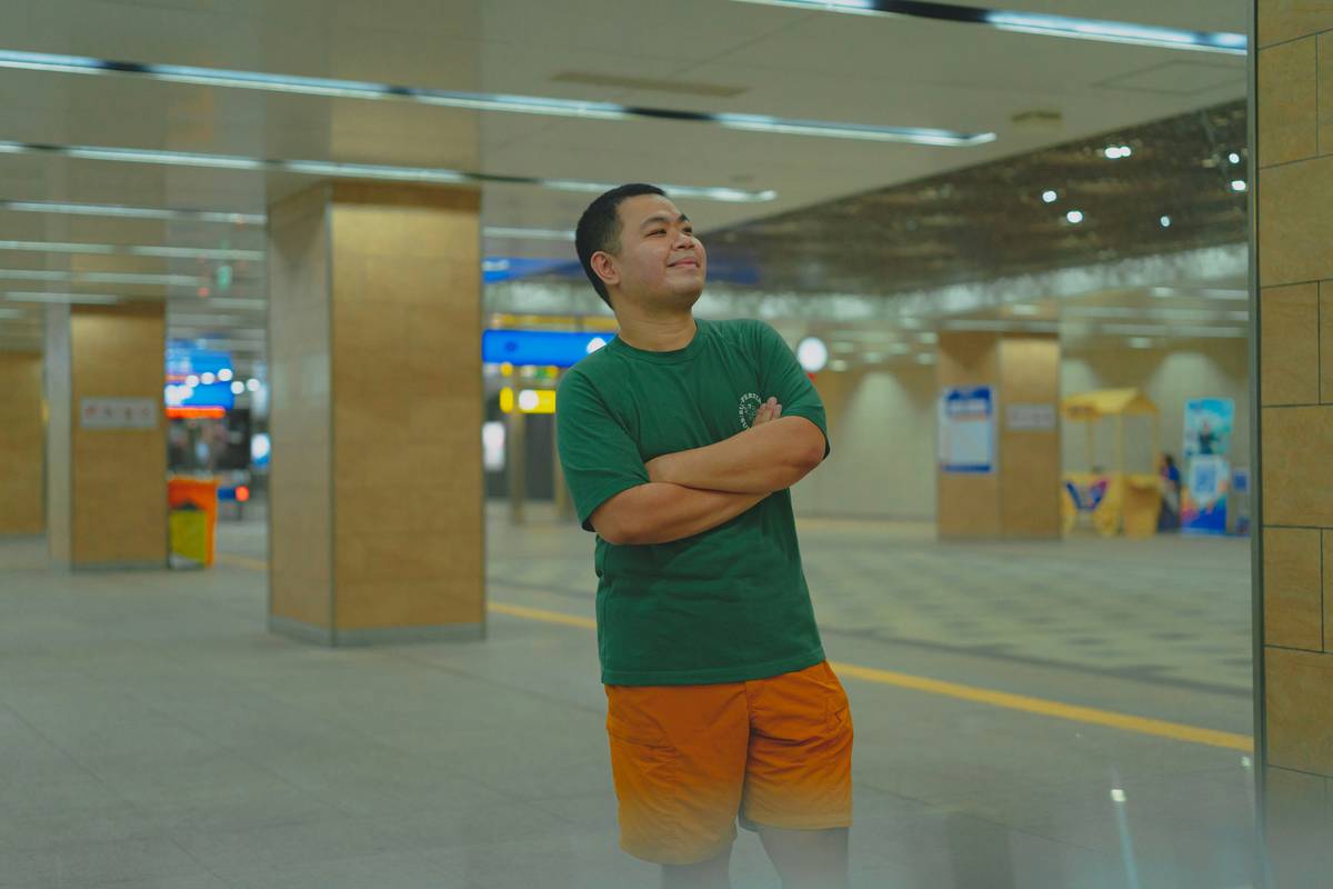 A crowded airport terminal with passengers waiting anxiously due to a delayed flight