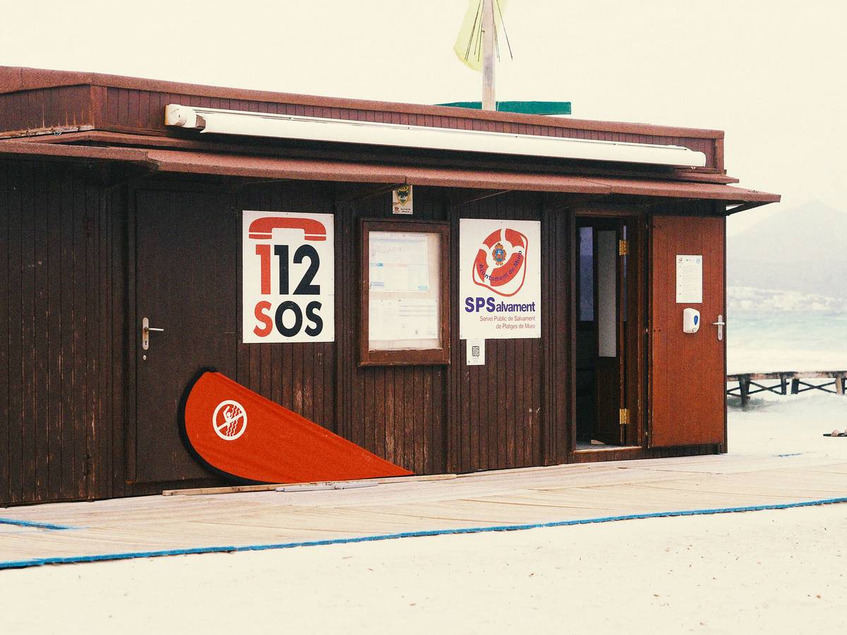 Sarah smiling while holding her reimbursement check from her travel delay insurance provider.